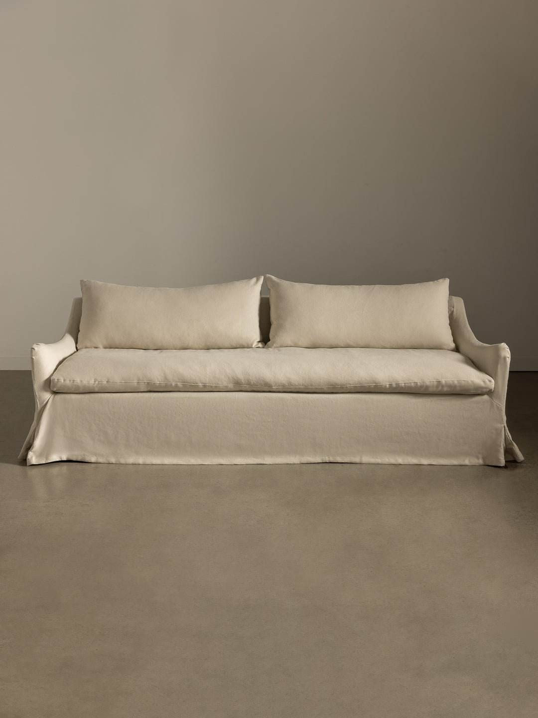 Rachel Donath Louis Creme Sofa against a plain wall