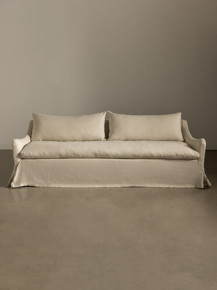 Rachel Donath Louis Creme Sofa against a plain wall